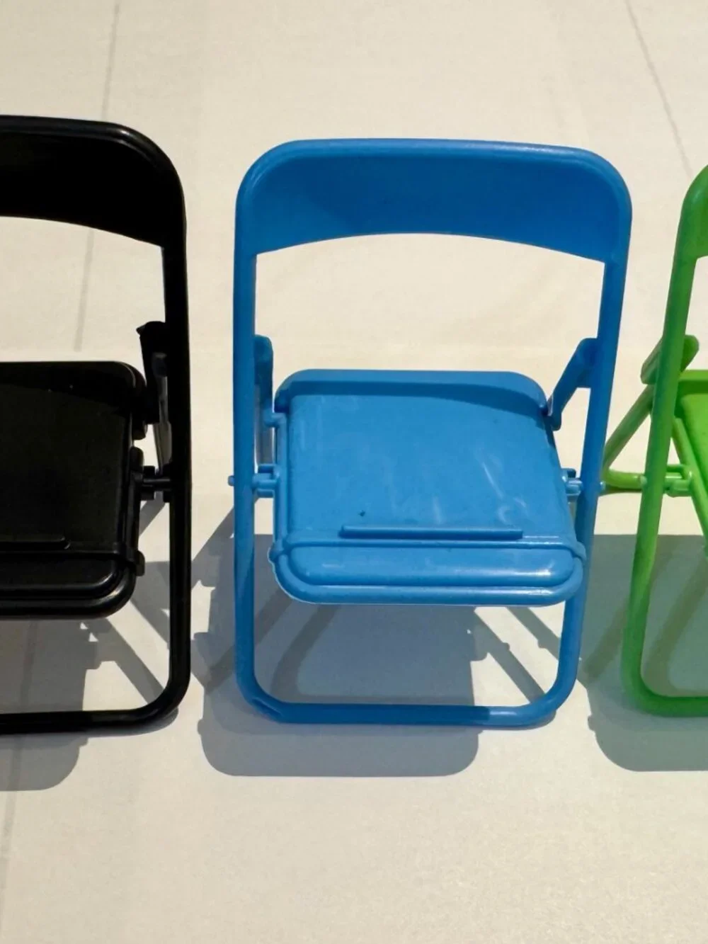 Purple Plastic Folding Chair Cell Phone Stand